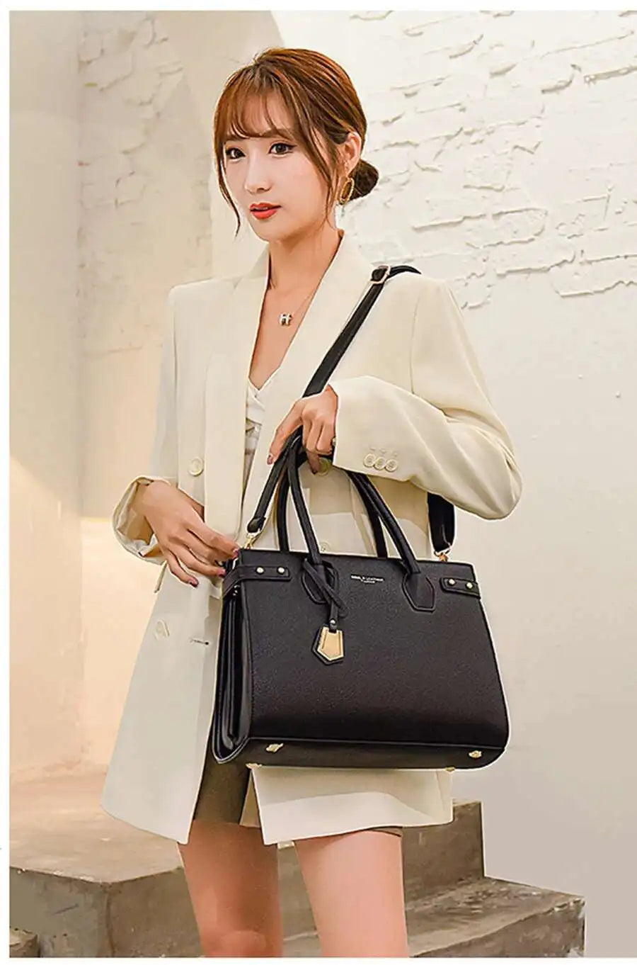 STRUCTURED LEATHER TOP-HANDLE HANDBAG
