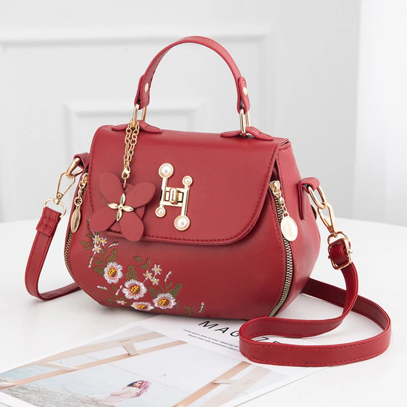 EMBROIDERED STRUCTURED TOP‑HANDLE CROSSBODY