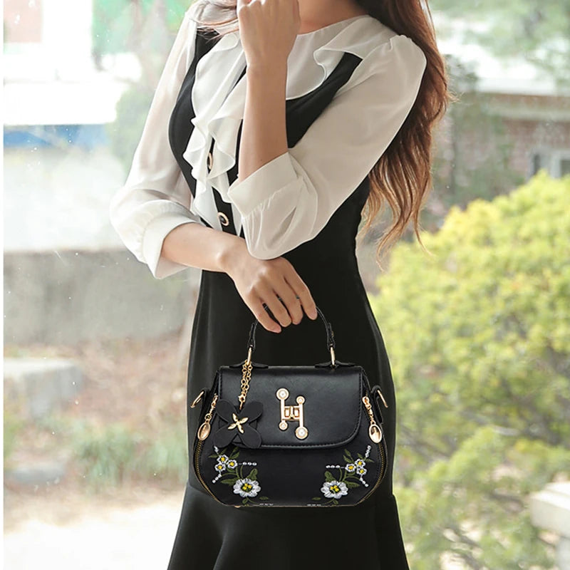 EMBROIDERED STRUCTURED TOP‑HANDLE CROSSBODY