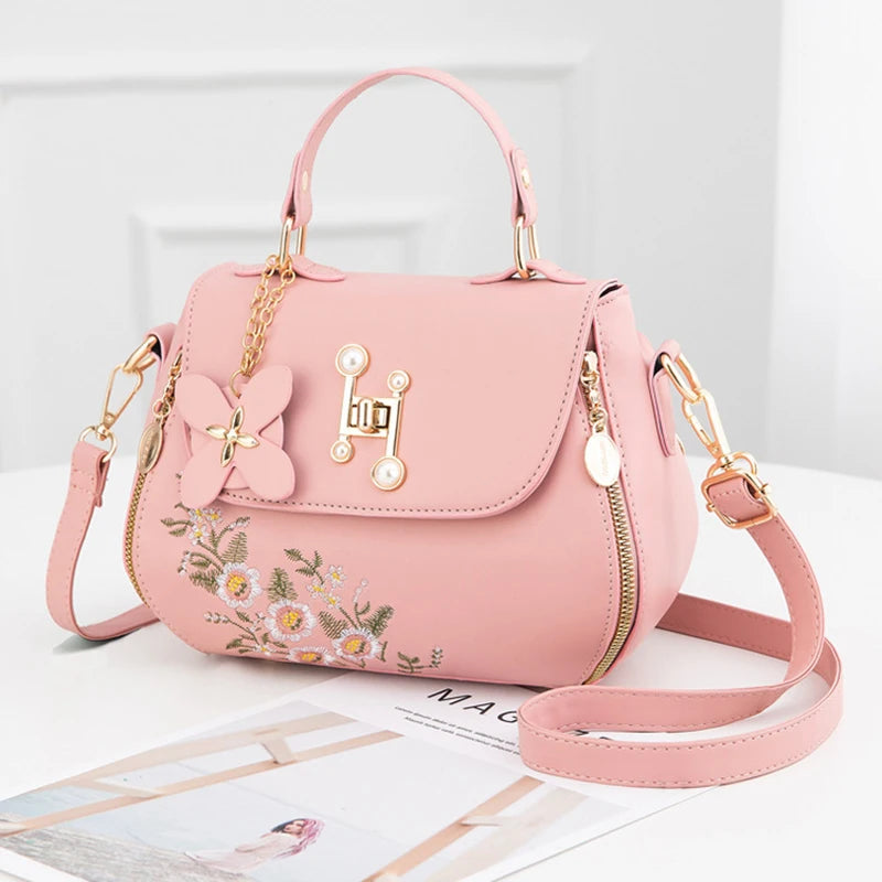 EMBROIDERED STRUCTURED TOP‑HANDLE CROSSBODY