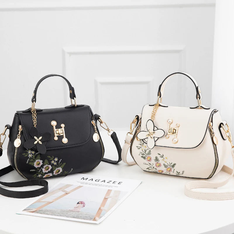 EMBROIDERED STRUCTURED TOP‑HANDLE CROSSBODY