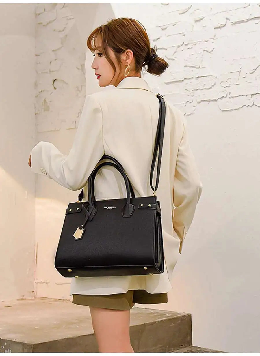 STRUCTURED LEATHER TOP-HANDLE HANDBAG