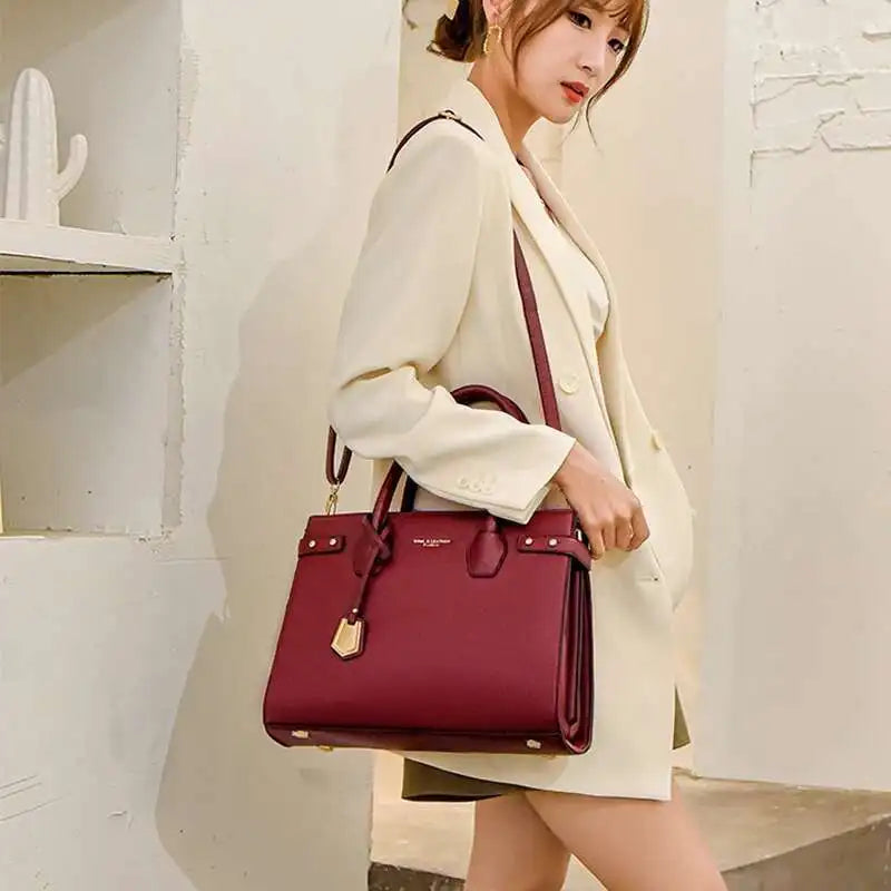 STRUCTURED LEATHER TOP-HANDLE HANDBAG