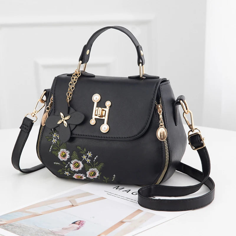EMBROIDERED STRUCTURED TOP‑HANDLE CROSSBODY