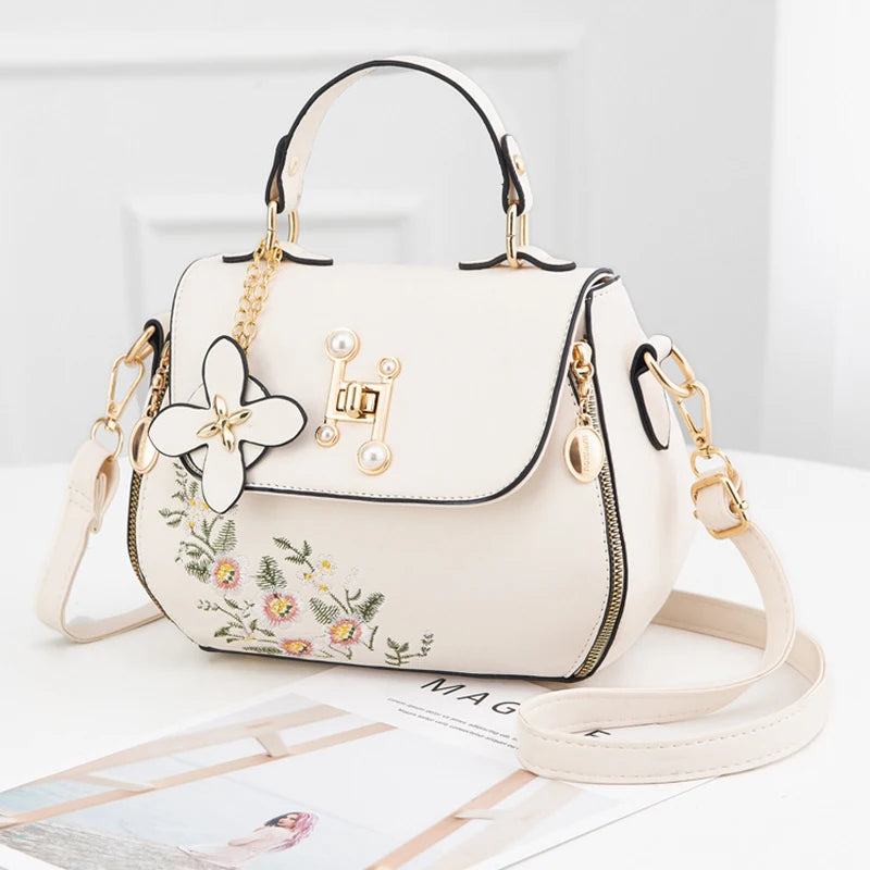 EMBROIDERED STRUCTURED TOP‑HANDLE CROSSBODY