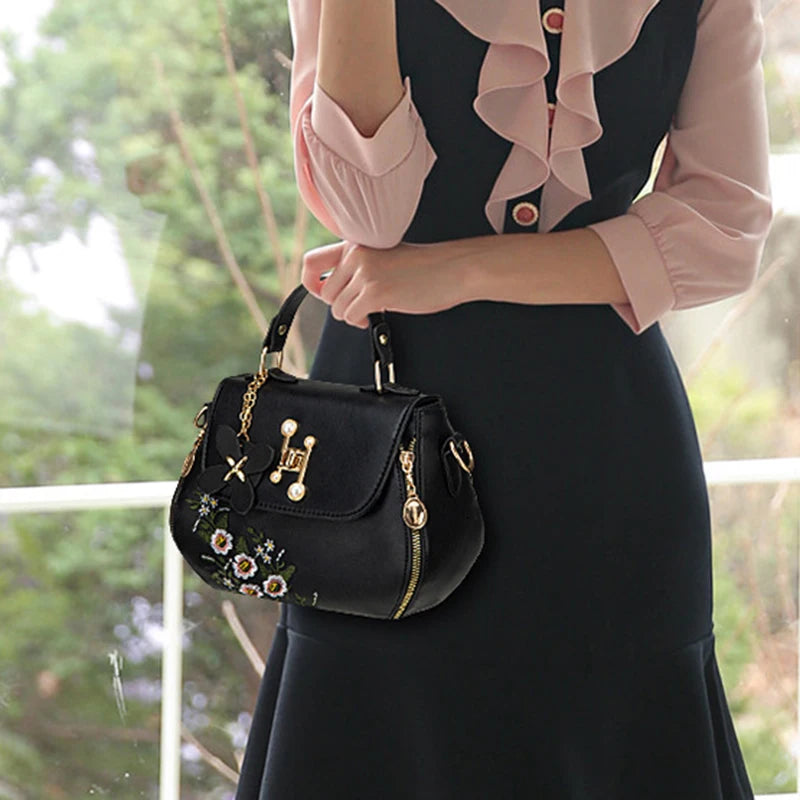 EMBROIDERED STRUCTURED TOP‑HANDLE CROSSBODY