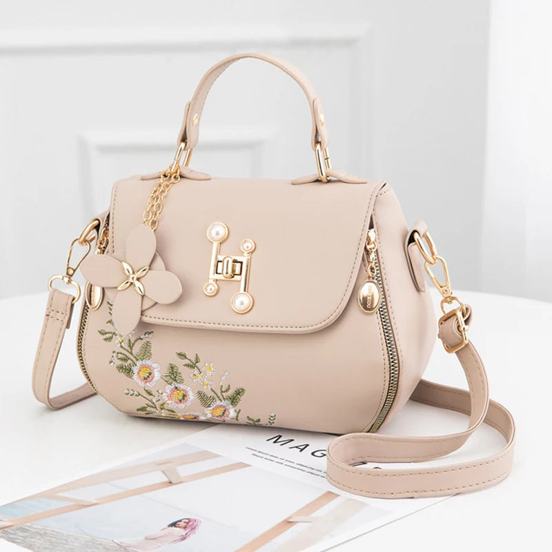 EMBROIDERED STRUCTURED TOP‑HANDLE CROSSBODY
